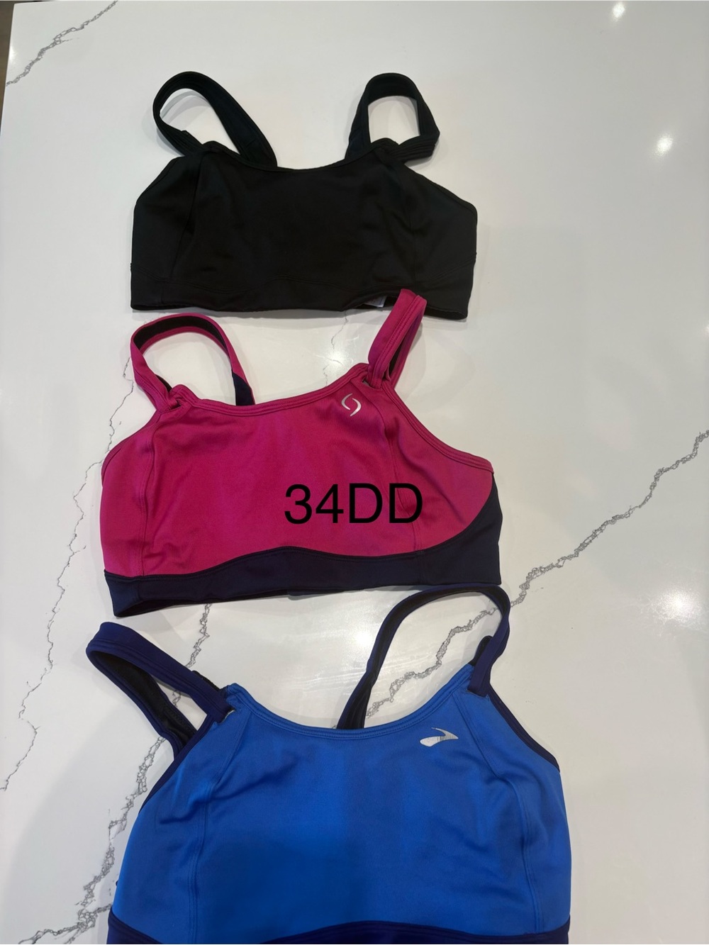 Brooks Women's Sports Bras in Black, Pink, and Blue